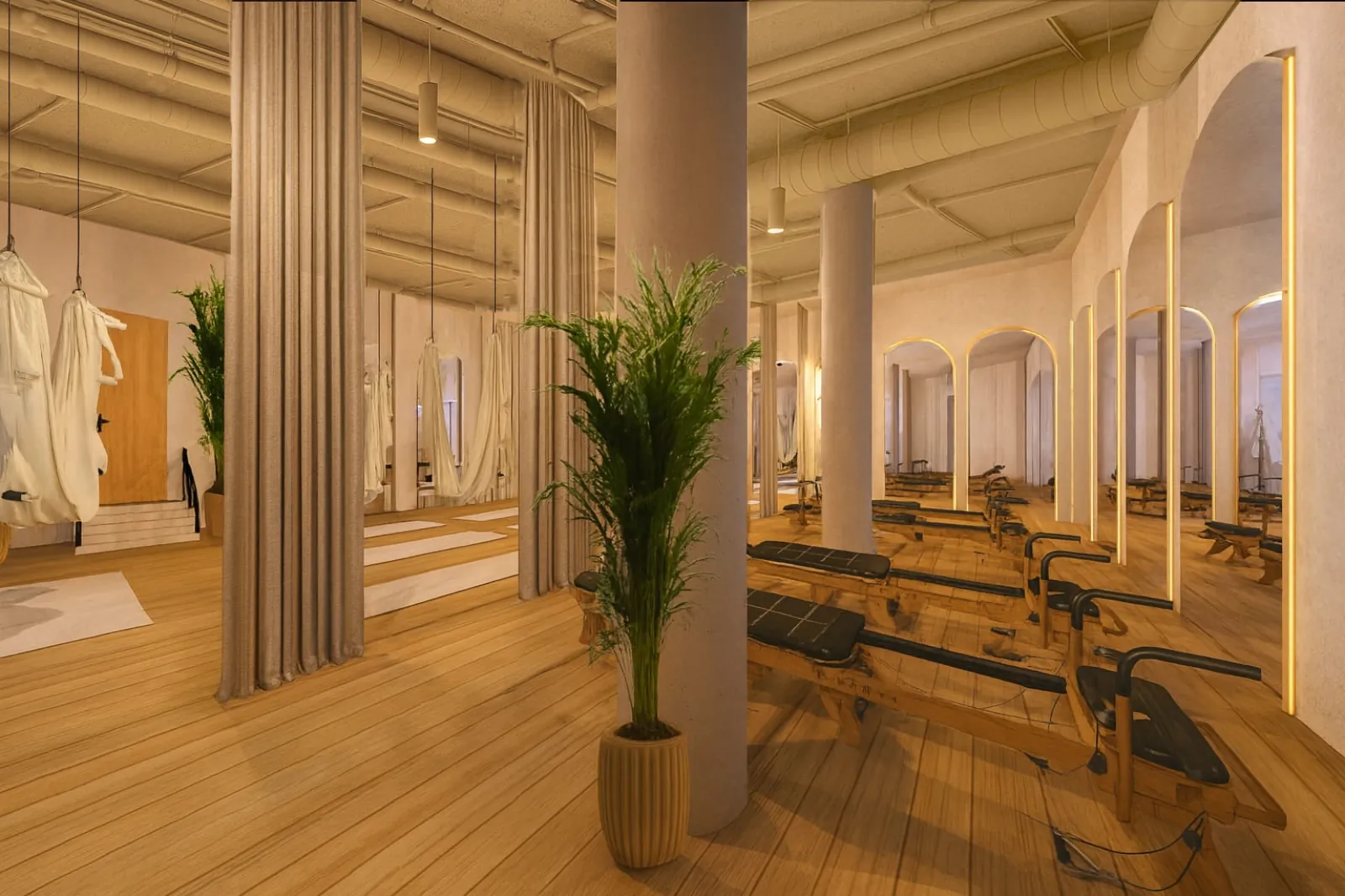 Boutique Pilates studio interior in Benahavís with reformers and warm wood floor